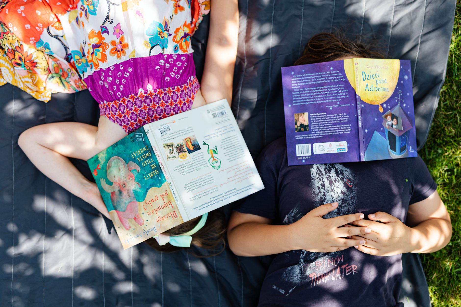 Child reading a colorful picture book about money and saving
