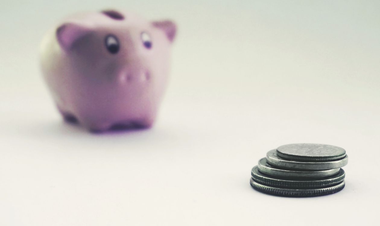 Coins and a piggy bank — teaching kids how to open a bank account
