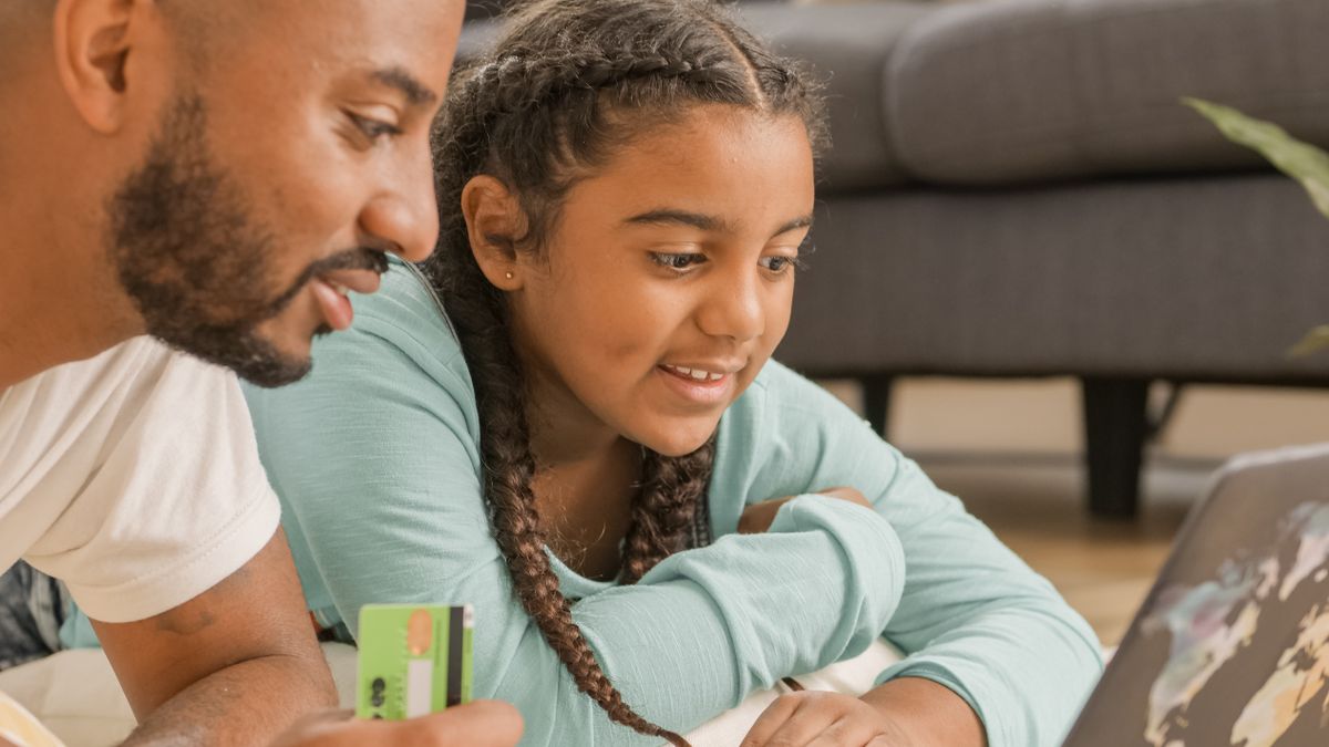 Father and son having a money conversation at home