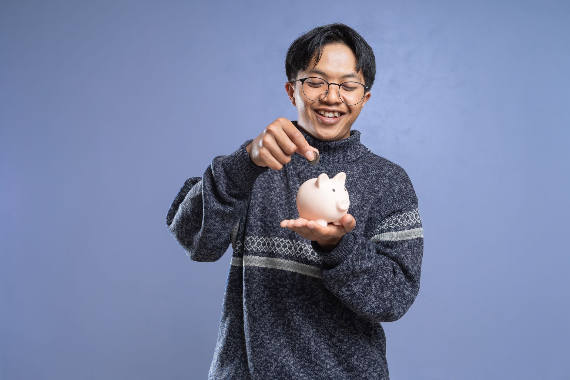 Teenager holding a debit card, ready to open their first bank account