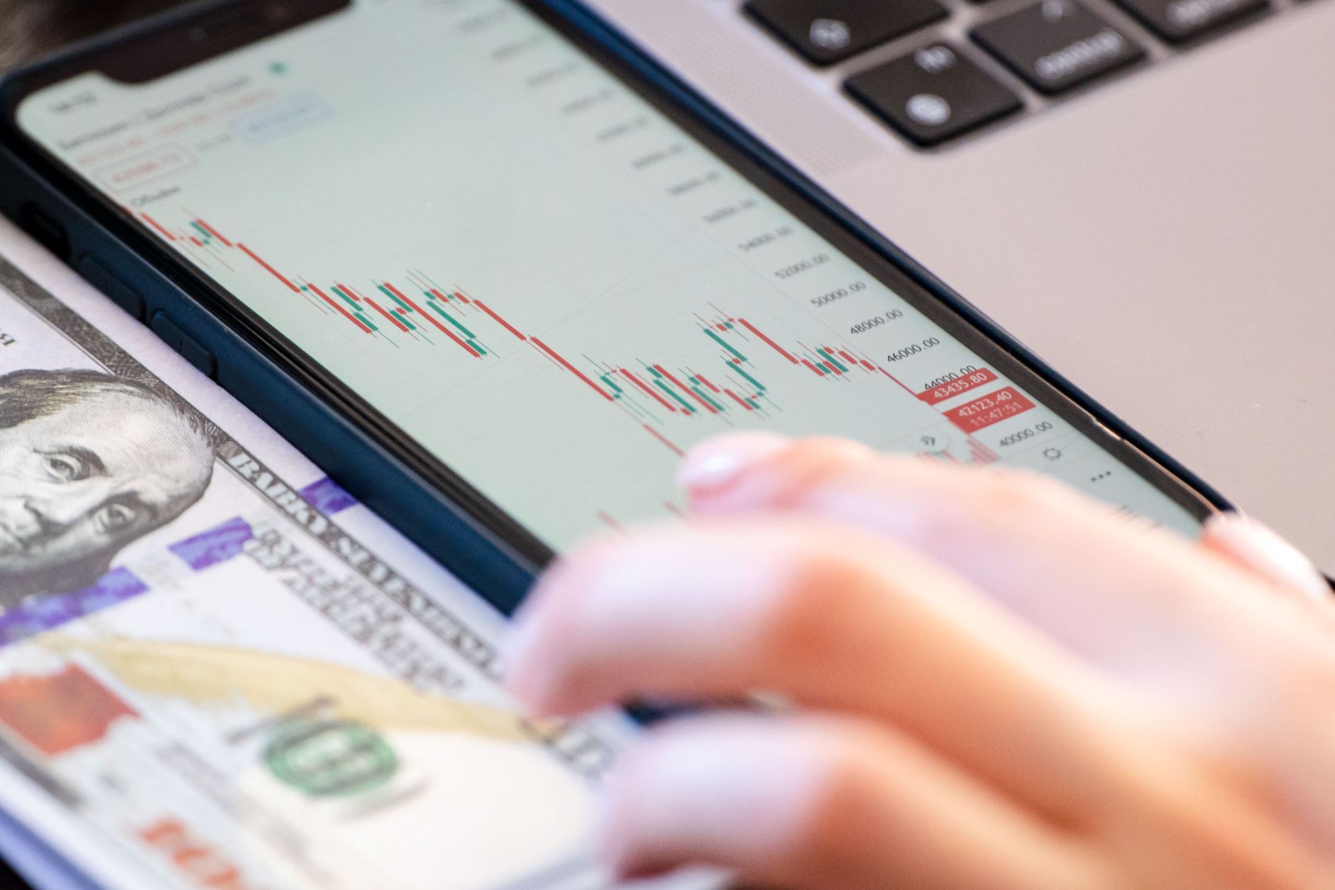 Parent and teenager reviewing Roth IRA account documents for a minor