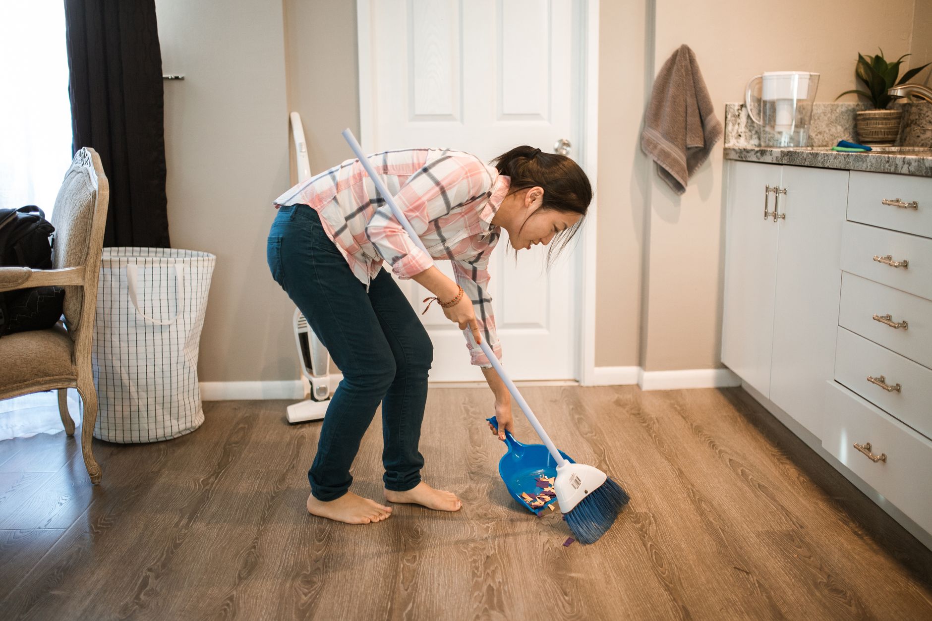 Young child doing chores at home to earn money
