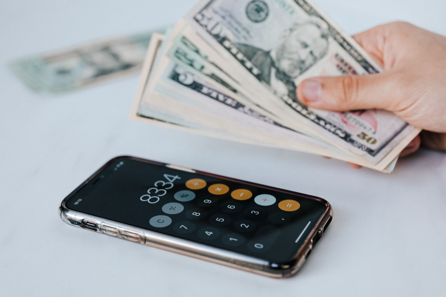 Child using a smartphone money app to track savings and learn financial skills