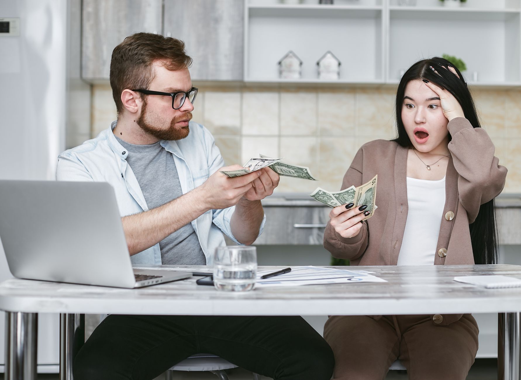 Parent helping child learn about savings and banking